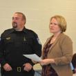 Town Manager Kara George (c) introduces Thomaston's new police chief, Eric Quatrano, at the official swearing-in ceremony at the start of a Select Board meeting, Oct. 15, 2025. (Photo by Sarah Thompson)