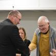 Paul Spear and Select Board member Peter Lammert shake hands. (Photo by Sarah Thompson)