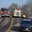 full road closure with police cruiser, two fire trucks