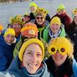 Group of women pose in selfie with yellow in their hats