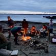 around a campfire on the beach