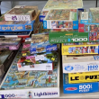 stacks of jigsaw puzzle boxes