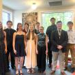 Group photo of young adults in formal attire