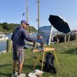 man painting at easel