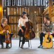 three musicians sitting in different seats