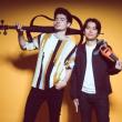 two males holding instruments