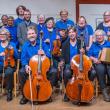 members of large band, all wearing blue shirts