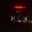 front of fire truck, rear of chief's vehicle