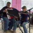Eric Tolman and his grandson, Ben Tolman, play the accordion in honor of David Dickey (Photo courtesy Monica Tolman)