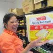 Glo's Market owner Claire Fuller displays the wrapping make up her famous Filopeno lumpia. Photo by Kay Stephens