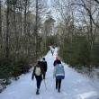 hikers on snowy trail