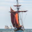 schooner with reddish sails