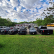 Cars begin to fill the lot at Edna Drinkwater School in Northport. (photo by Erica Thoms)