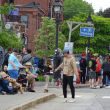People lined either side of Main Street to watch the procession. (photo by Erica Thoms)
