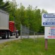 truck passing through gated entrance
