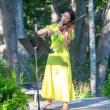 violinist in yellow dress