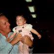 adult man holding toddler girl