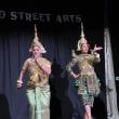 two women, street arts words in background