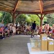 large group of people seated in gazebo