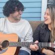 male and female with guitar