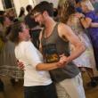 man, woman dance close