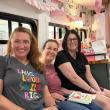 Read Between the Spines Book Club members: Meesh Preston Maureen Petone and Tarsha Richmond on the bus. Photo courtesy Meesh Preston
