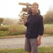 Director Luke Lorentzen holding a video camera