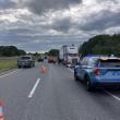 vehicles parked on highway with wrong-way facing tractor trailer truck