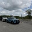 cruiser and white truck
