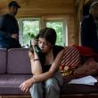 young woman talking on a landline phone.