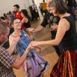 four people in circle dance