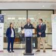three people at lectern