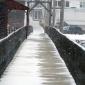 Footbridge during a winter storm Footbridge during a winter storm