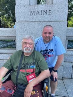 Danny L. Swindler poses with his son, Danny, at the Maine sign. (Photo courtesy Danny Swindler/Dawn Bailey)