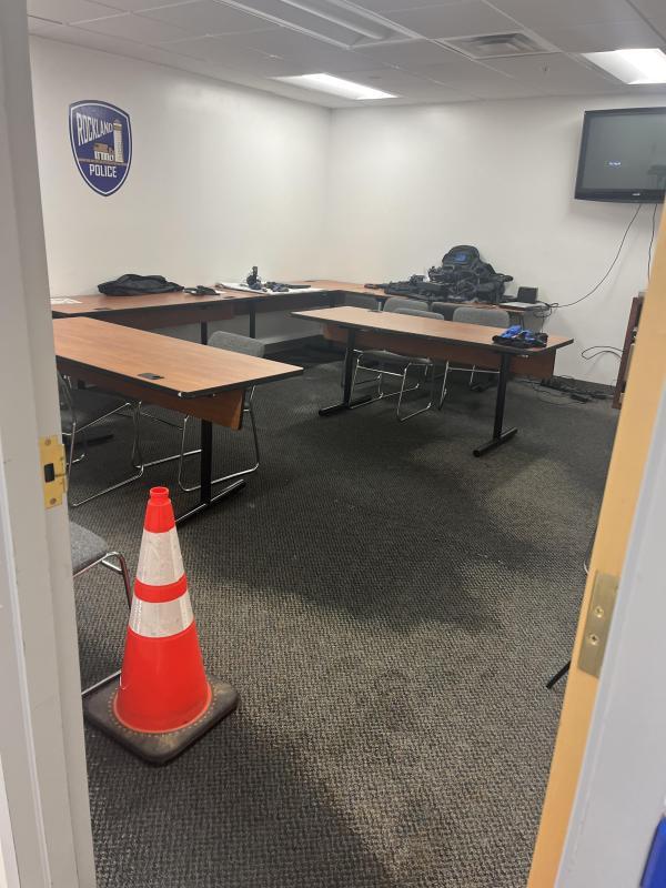 safety cone marks a water-soaked carpet