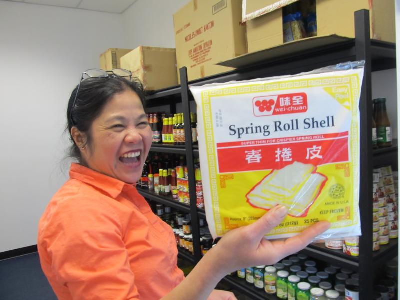 Business owner Claire Fuller displays the wrapping make up her famous Filopeno lumpia. Photo by Kay Stephens 