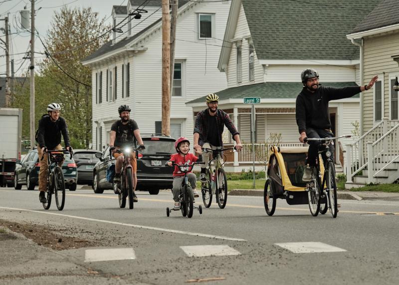 Four men, one child bike down south Main Street in Rockland