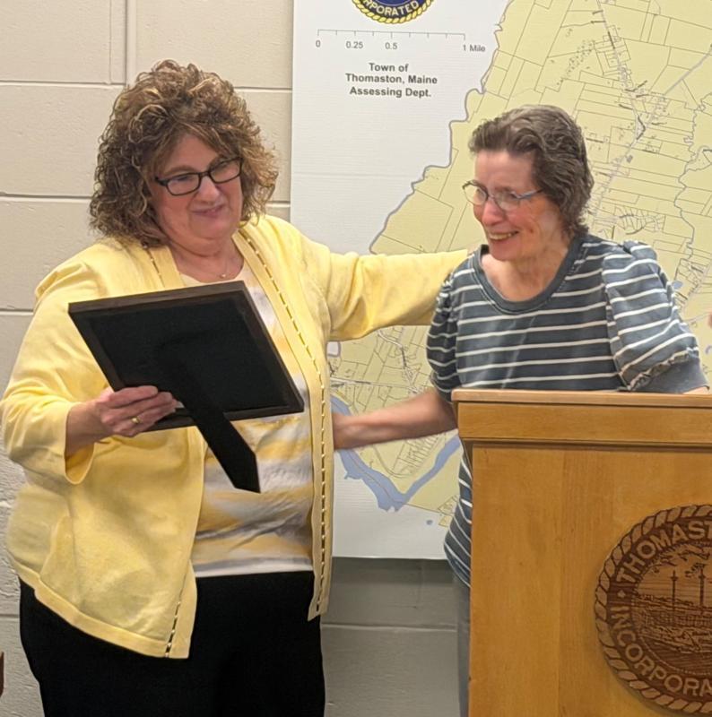 woman presents accommodation to another woman