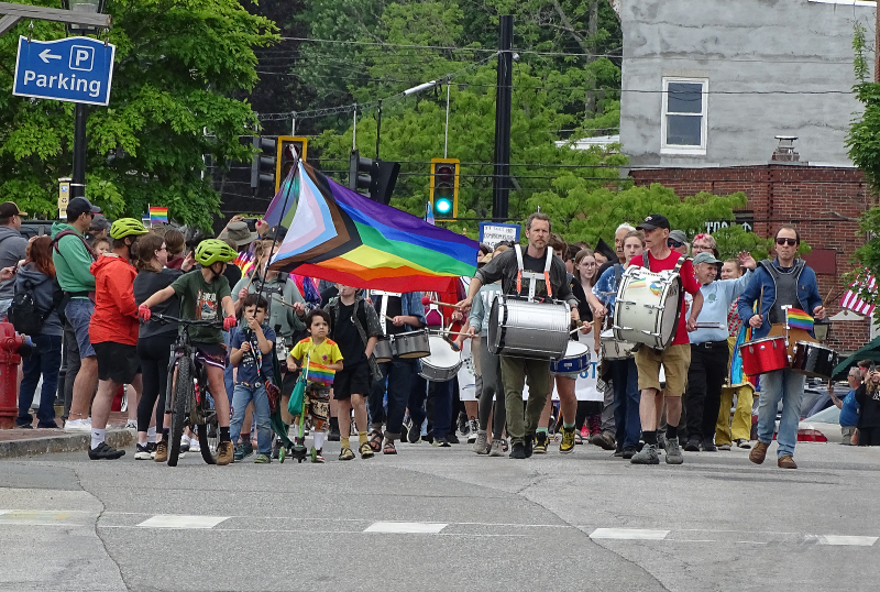 The streets of downtown are filled with a sea of pride flags as drum beats fill the air. (photo by Erica Thoms)