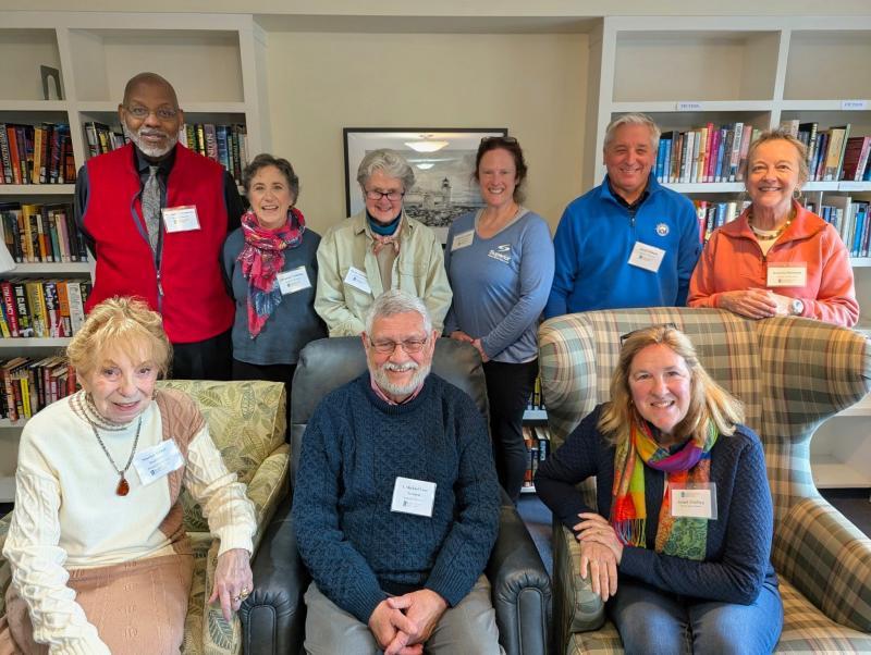 Nine adults pose for picture