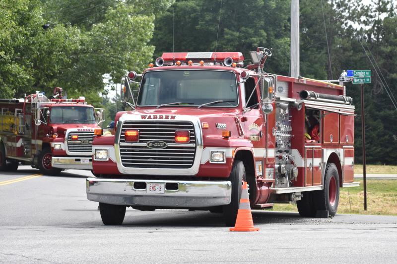 fire trucks in foreground, background