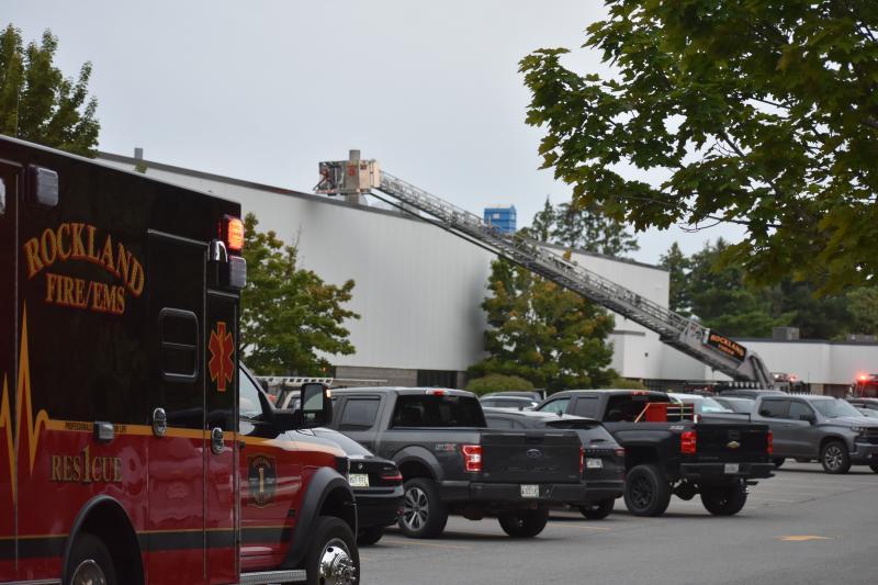 parking lot scene with ambulance, ladder truck