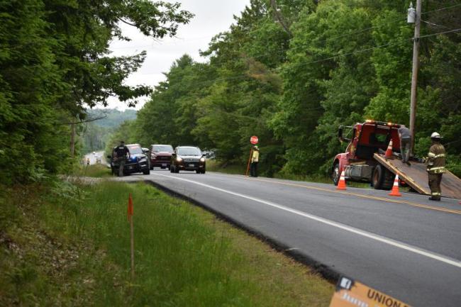One vehicle is loaded onto an All Directions wrecker after a June 19 chain-reaction crash on Heald Highway. (Photo by Sarah  Thompson)