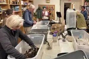 People working with items in bins