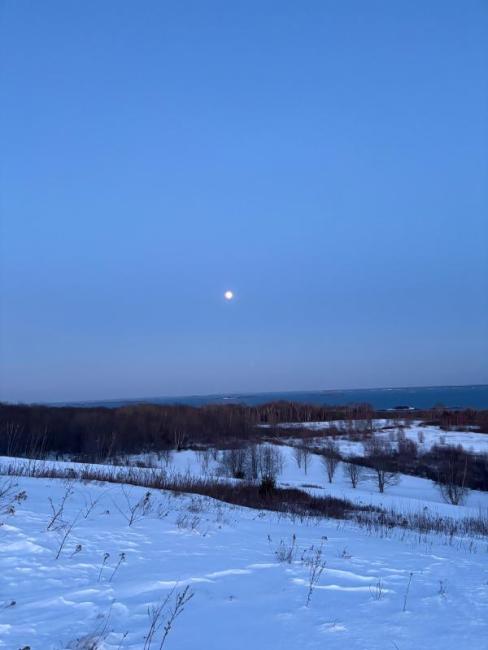 Snowy view and full moon