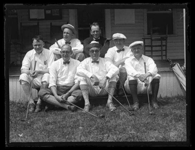 Black and white photo of a group of golfers