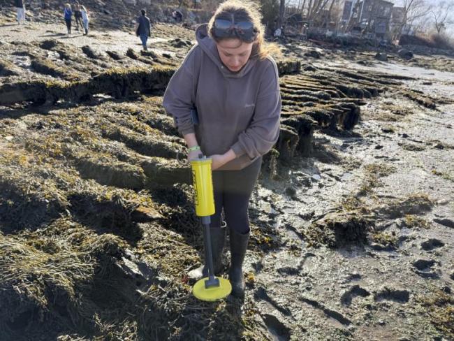 upclose picture of female student using piece of equipment