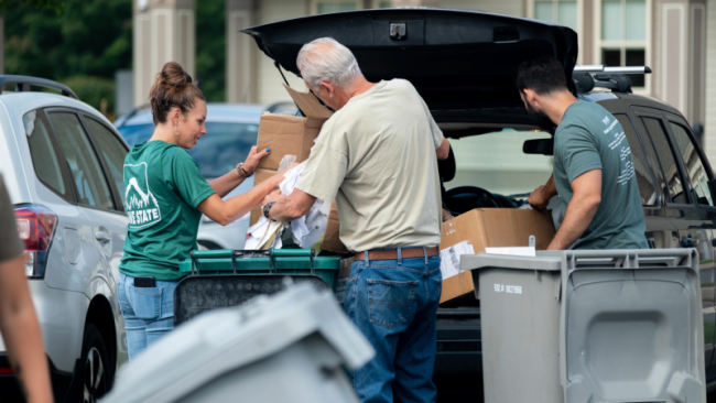 people filling bins