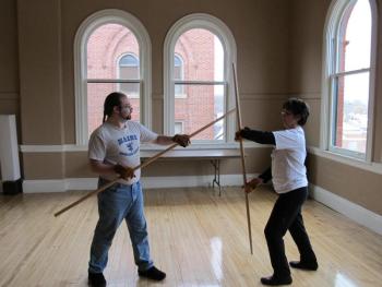 Staff fighting (Jay Inglis left, Sandi Bilbo, right)