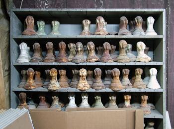 Shelves of legs for clawfoot tubs line the walls of a room in Coughlin's shop. (Photo by Ethan Andrews) Shelves of legs for clawfoot tubs line the walls of a room in Coughlin's shop. (Photo by Ethan Andrews)